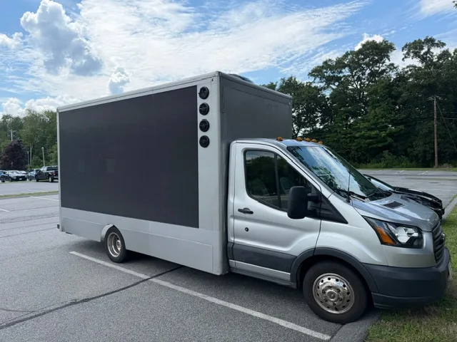 Driver-side view of the mobile LED billboard truck for sale with the 13 ft x 7 ft screen