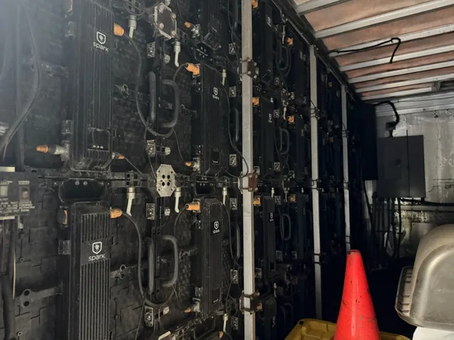 Spark-branded power supply units inside the LED billboard truck