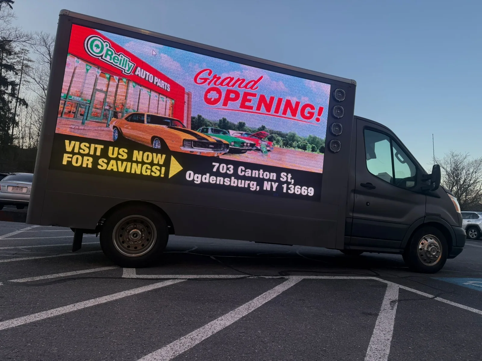 Used mobile LED advertising truck for sale parked with both P3.9 side screens lit