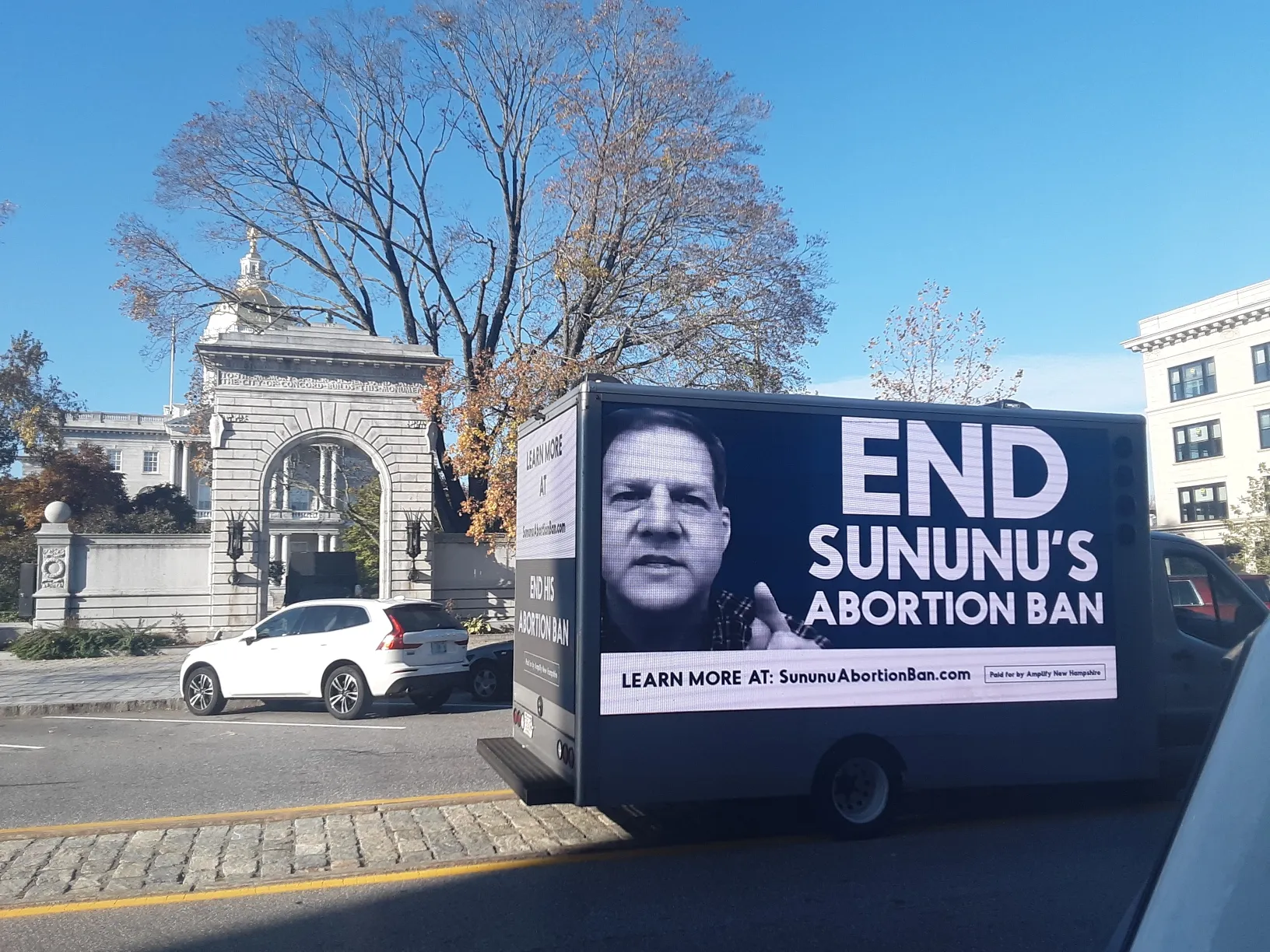 LED billboard truck displaying an advocacy message about a New Hampshire abortion law