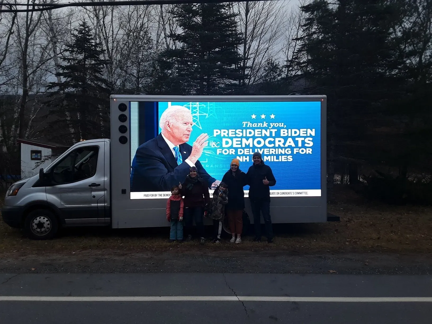 LED truck displaying a message thanking President Biden and Democrats for infrastructure legislation