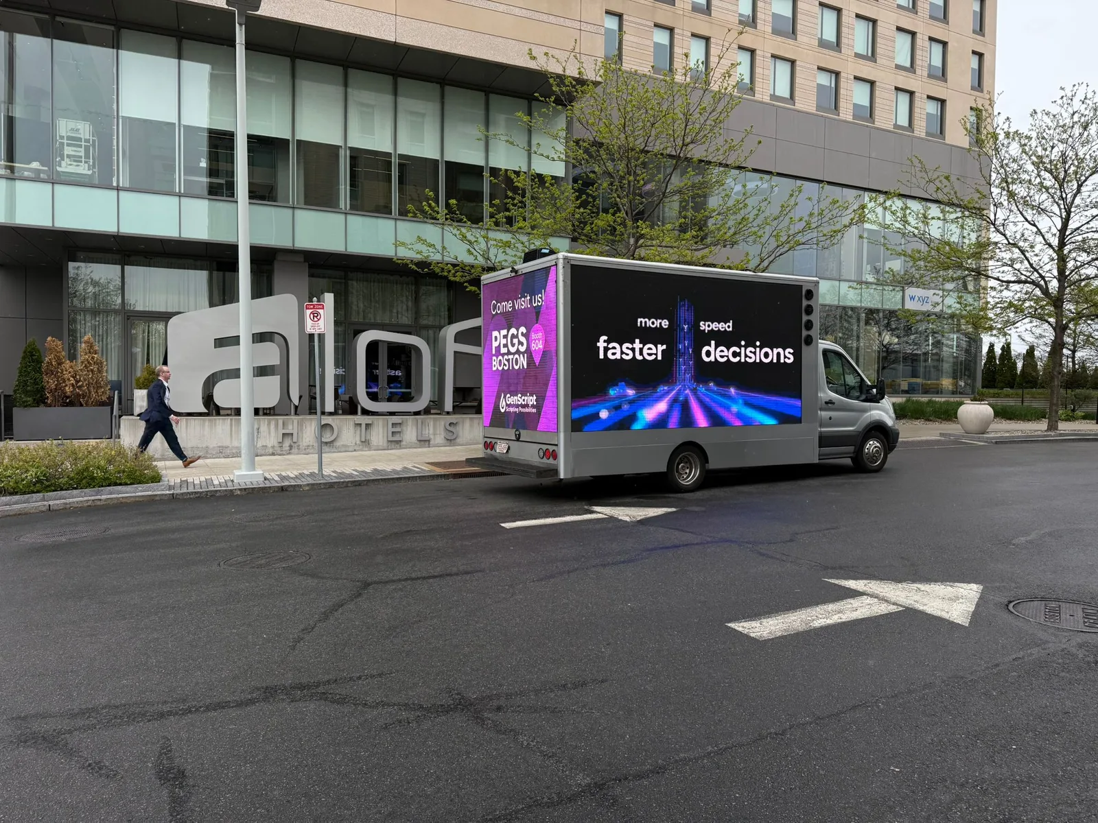 LED advertising truck for sale displaying a client campaign outside a hotel