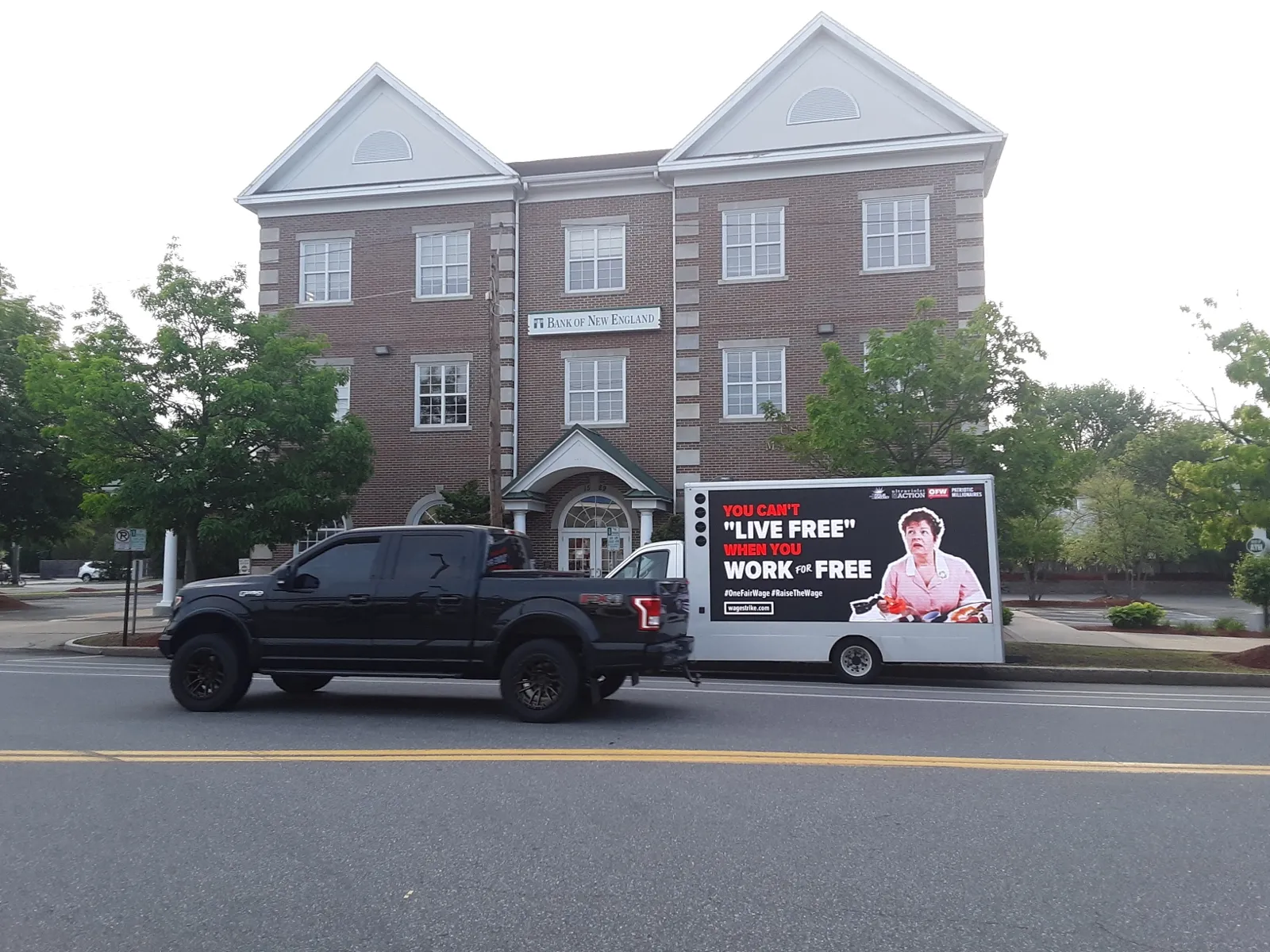 LED billboard truck with a One Fair Wage 'You can't live free when you work for free' message