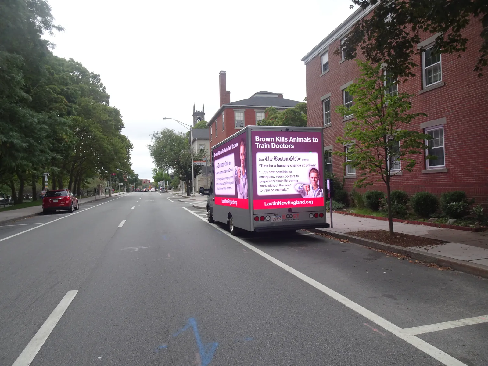Advocacy LED billboard truck driving a college campus street in Providence