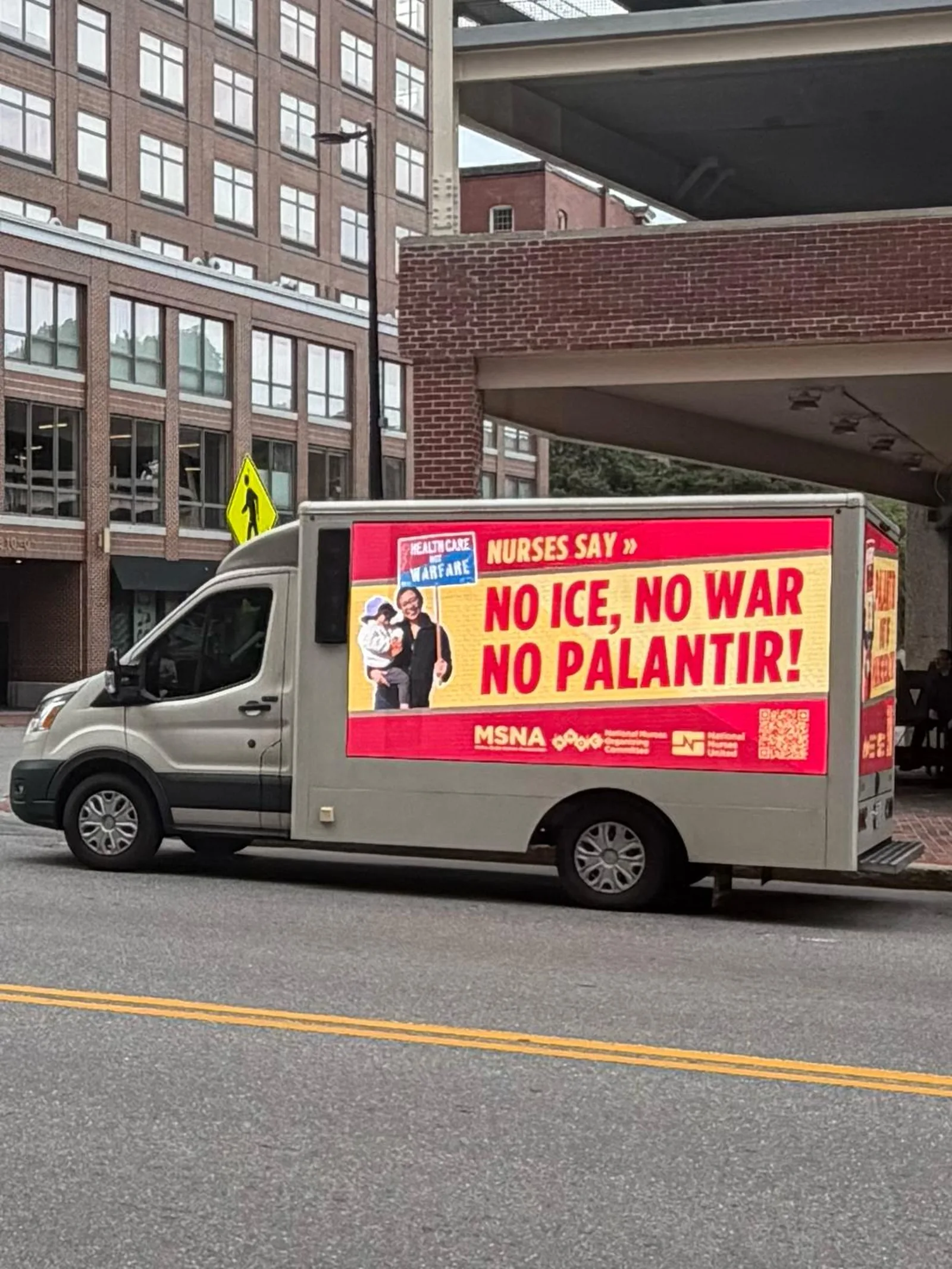 Side LED screen of an advocacy advertising truck in Portland Maine showing a large three-second headline