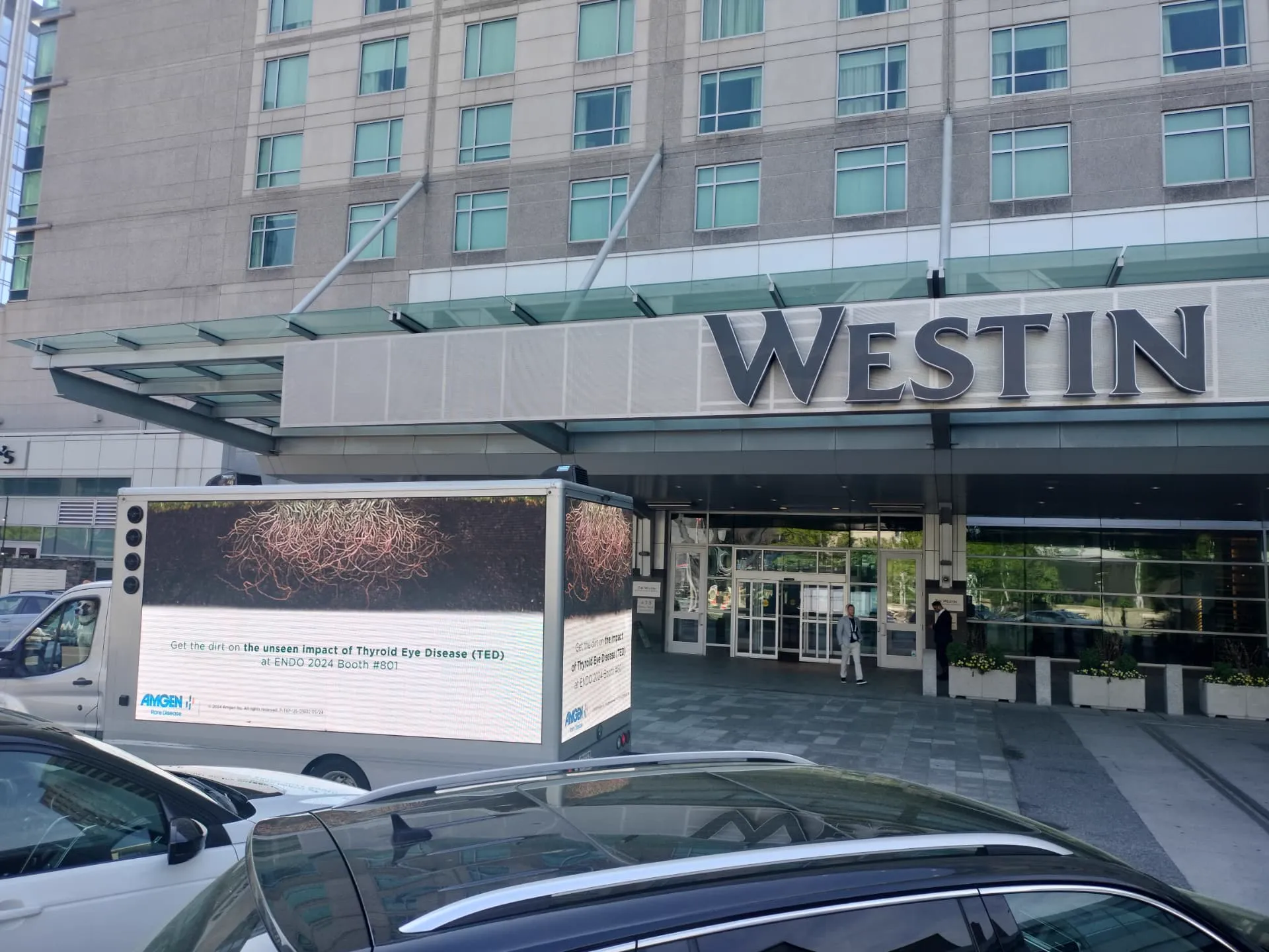 Amgen LED billboard truck outside the Westin Boston Seaport District during the ENDO 2024 medical conference
