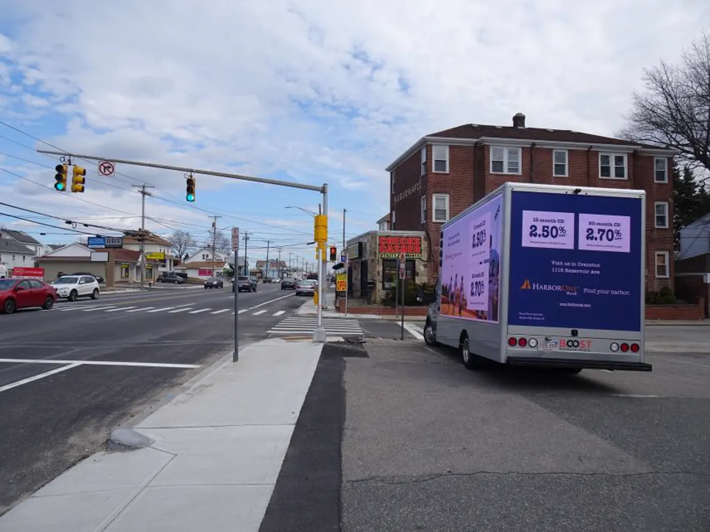 Rear LED screen showing the nearest bank branch address on a Cranston, RI intersection