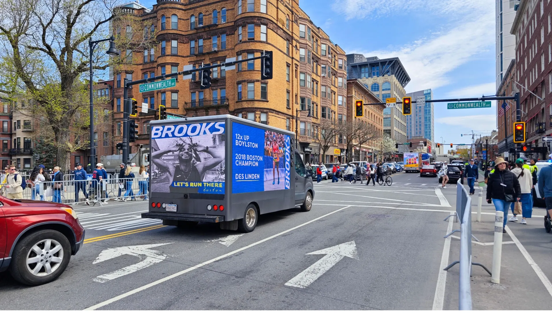 Brooks LED billboard truck advertising Des Linden on Commonwealth Avenue during Boston Marathon events