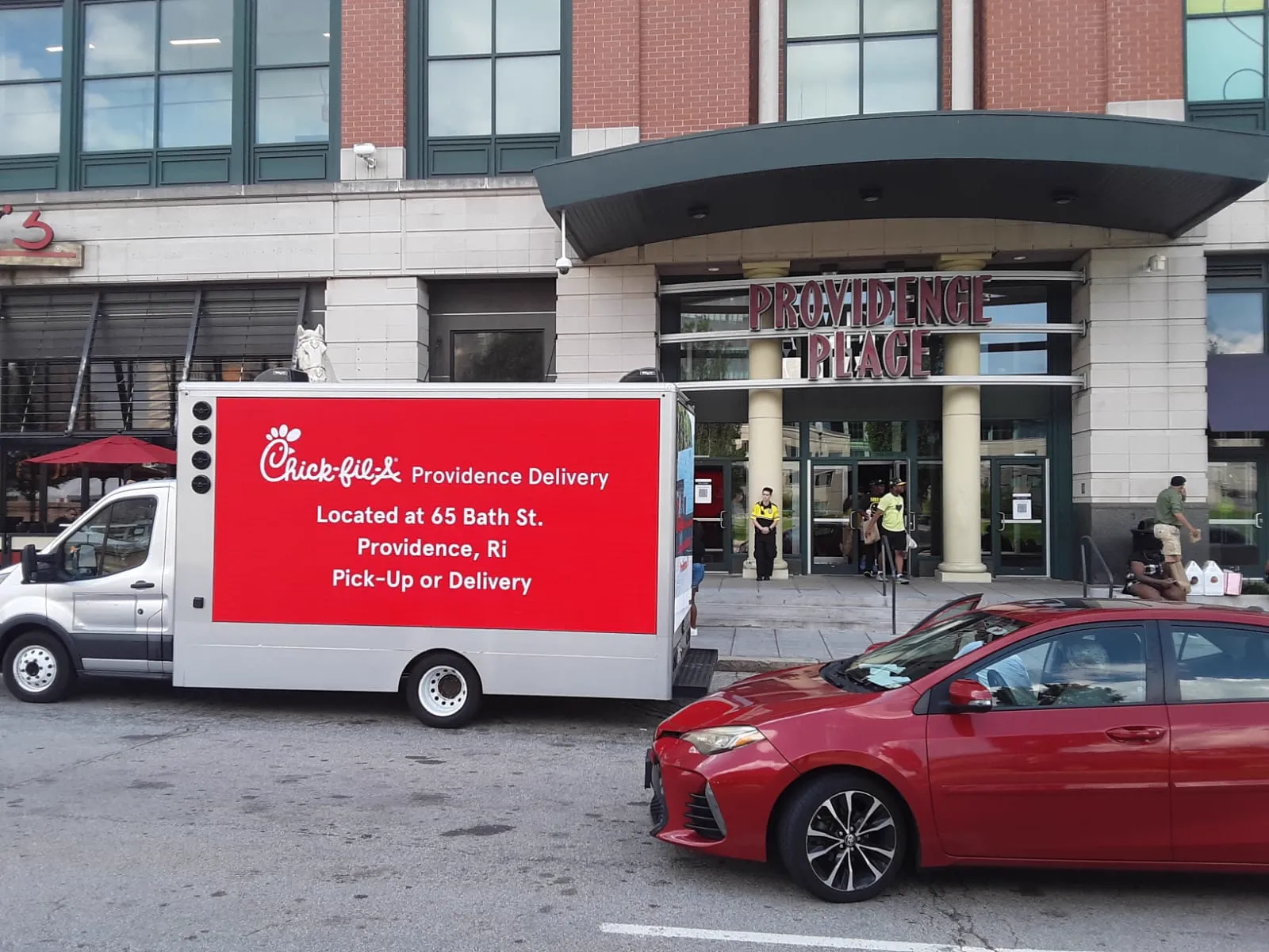 Chick-fil-A LED billboard truck parked outside the Providence Place mall entrance in Providence, Rhode Island