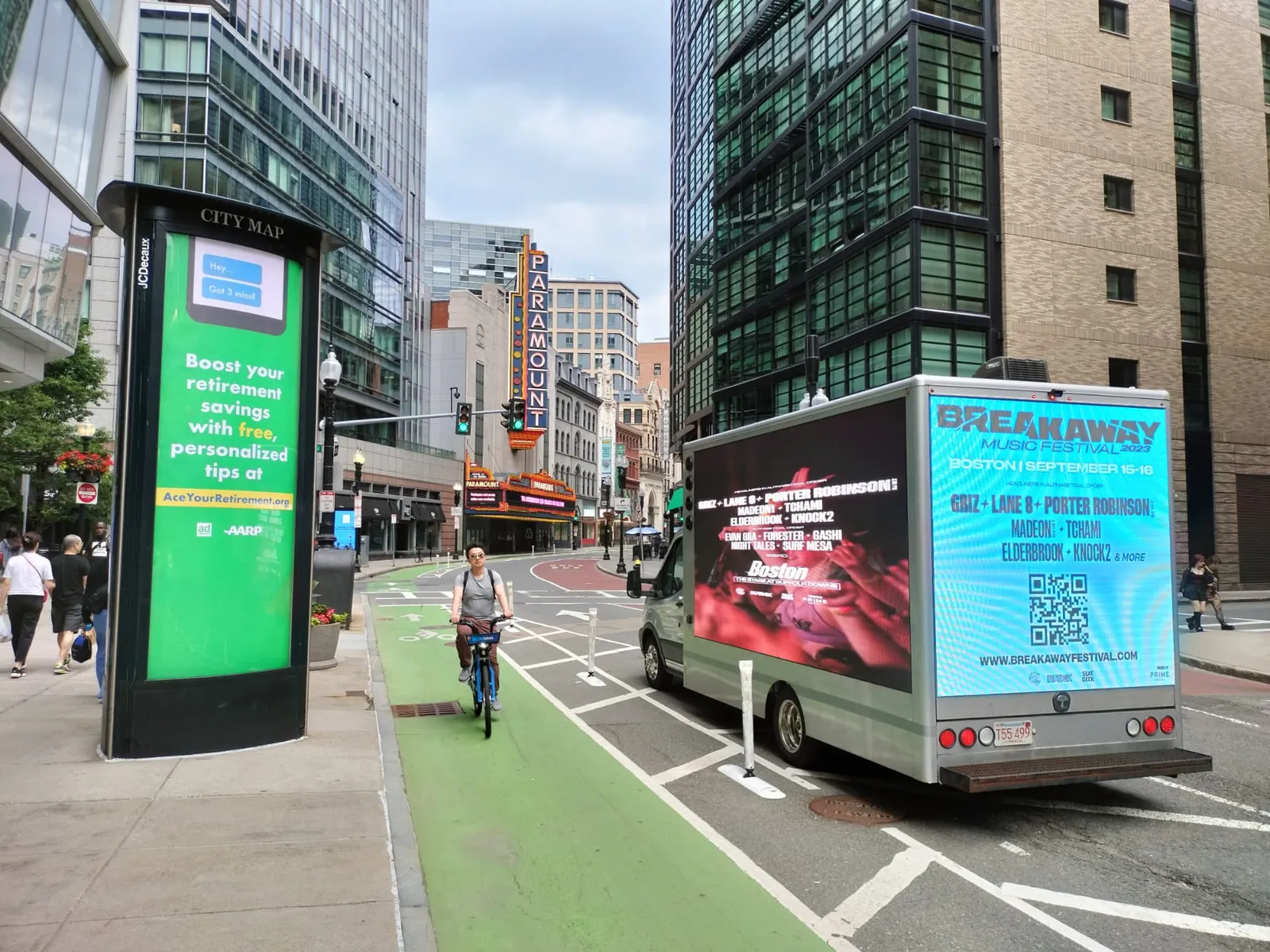 LED billboard truck promoting a music festival lineup in Boston's Theater District near the Paramount