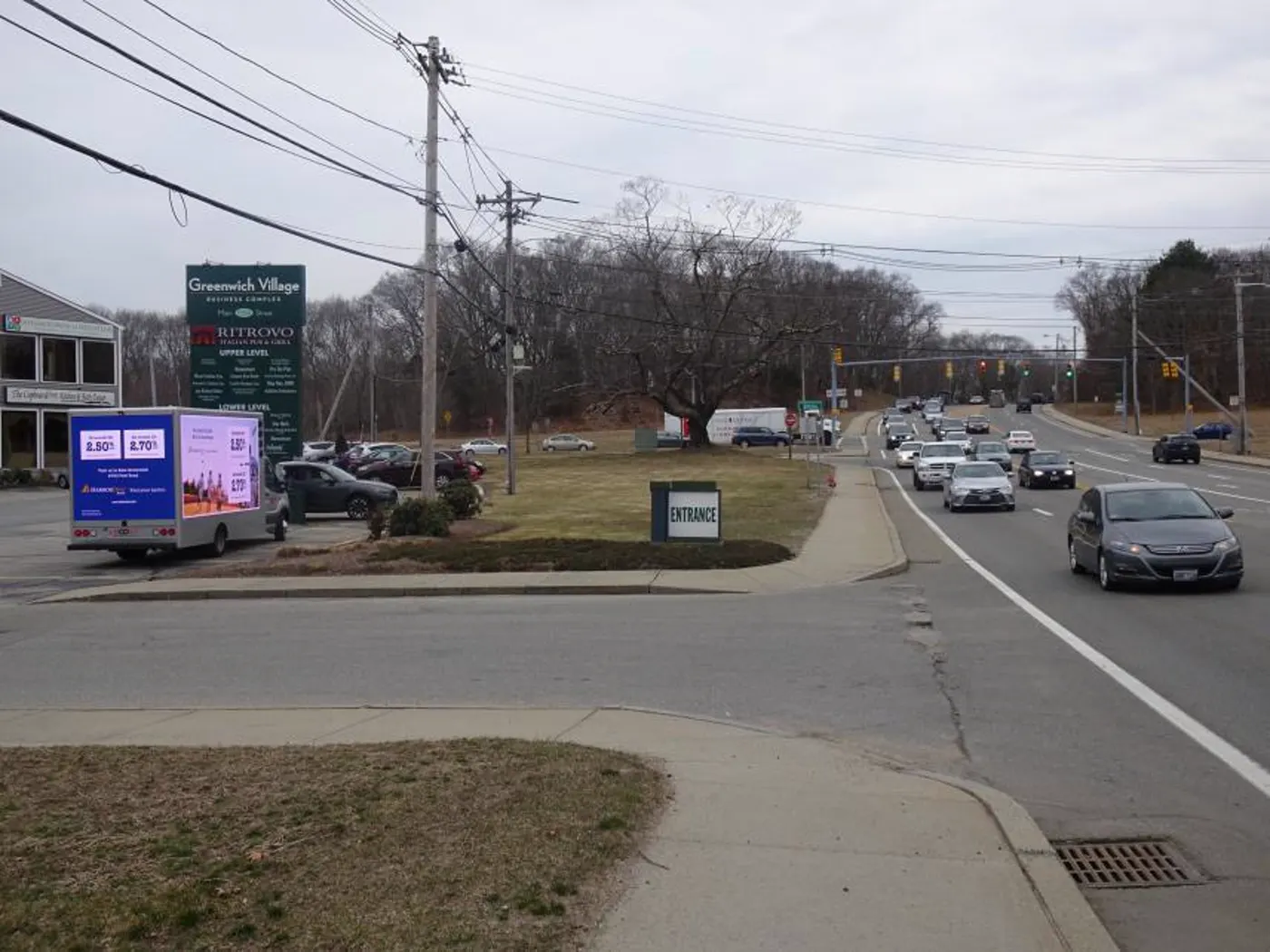 LED billboard truck advertising a bank at a shopping plaza entrance