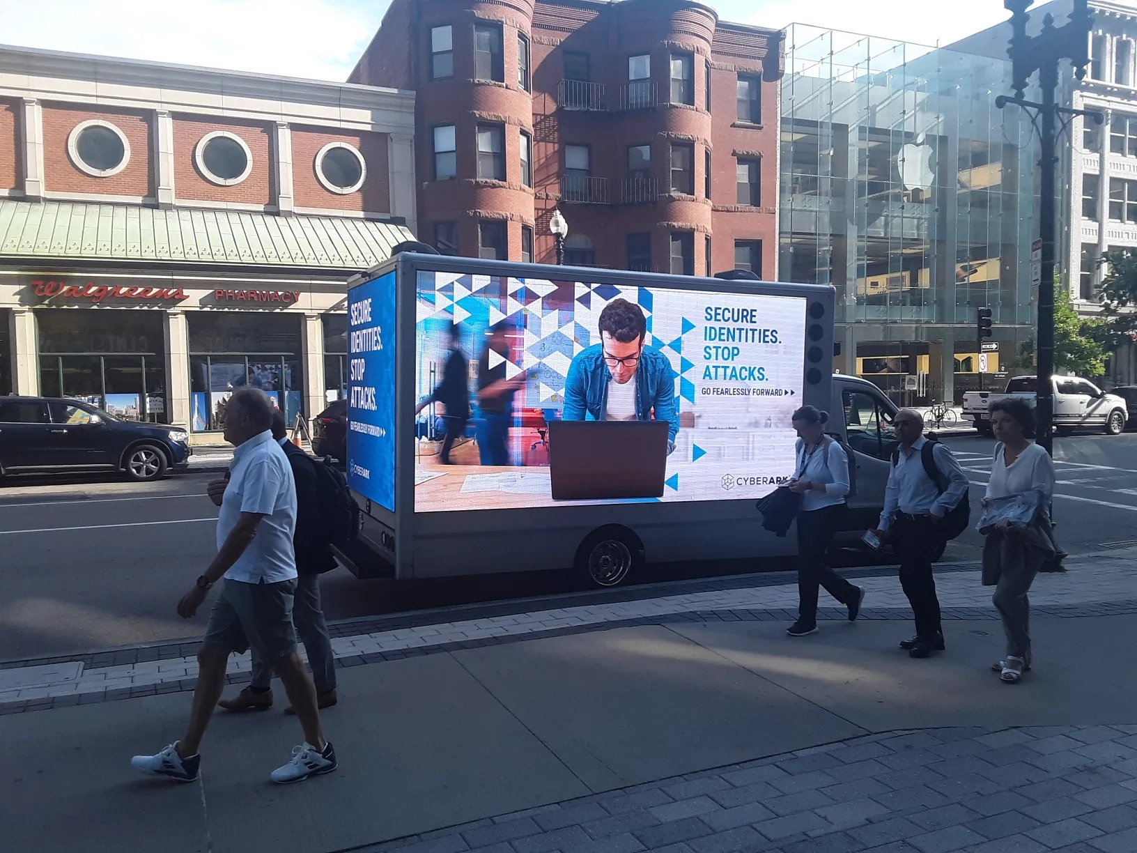 CyberArk mobile billboard advertising IMPACT 2022 to pedestrians near Hynes Convention Center on Boylston Street Boston