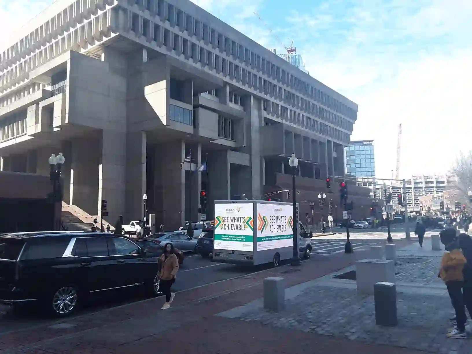 Dupixent LED billboard truck on a downtown Boston street near City Hall during a convention campaign