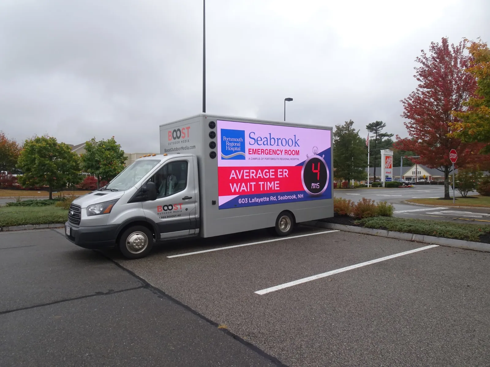 Mobile LED billboard truck displaying Seabrook Emergency Room average ER wait time in Seabrook, New Hampshire