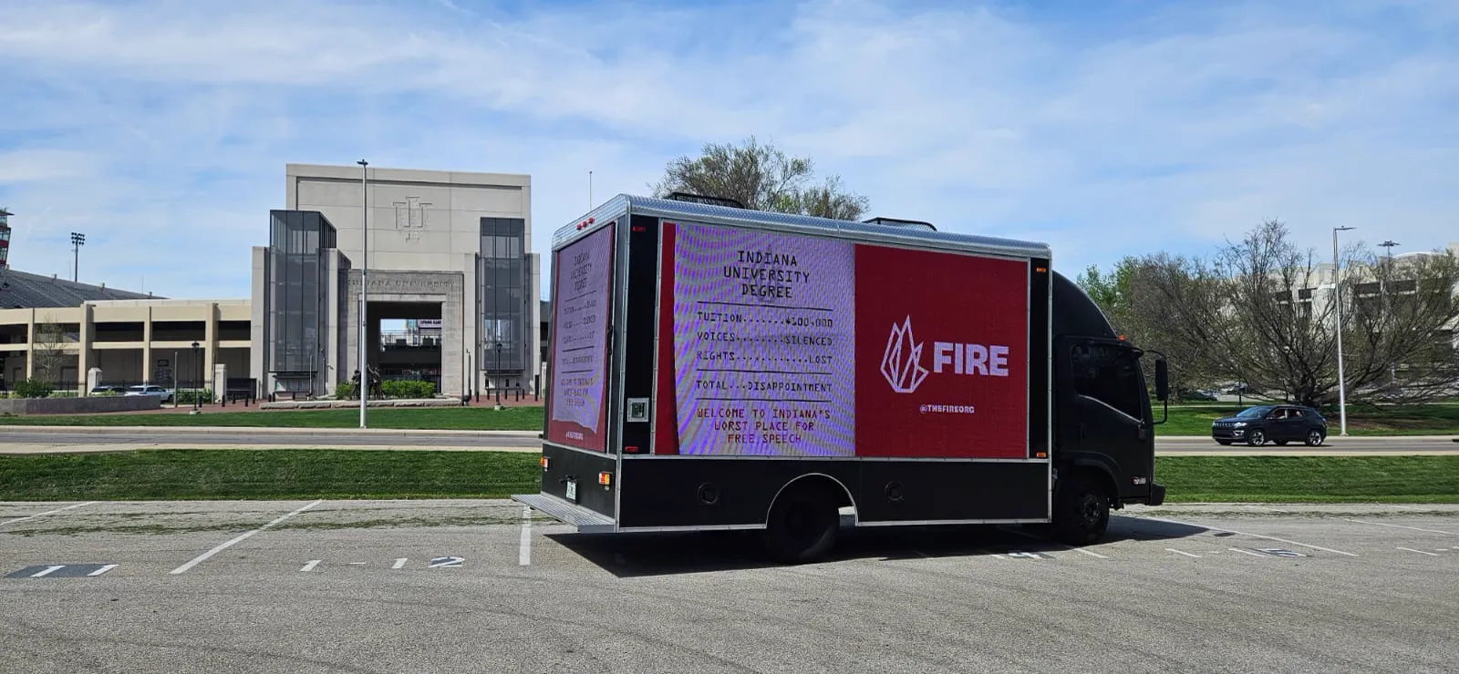 FIRE LED billboard truck with side and rear screens near Indiana University Memorial Stadium in Bloomington
