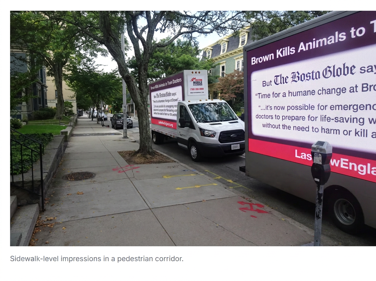Mobile LED billboard truck displaying an advocacy message near the Rhode Island State House in Providence