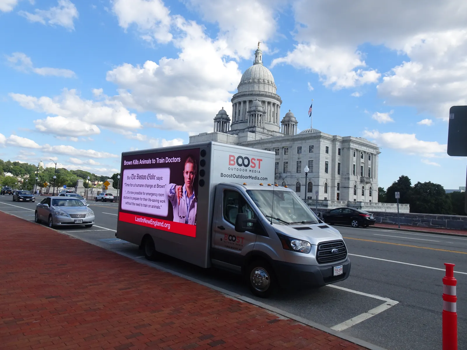 Mobile LED billboard truck running an advocacy message past the Rhode Island State House in Providence
