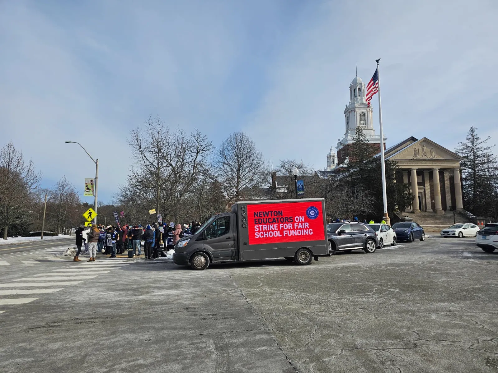 LED billboard truck reading Newton Educators on Strike for Fair School Funding at Newton City Hall, Massachusetts