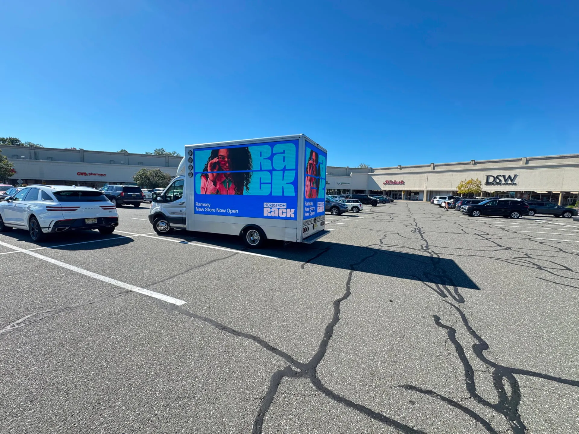 Rear LED billboard screen displaying Nordstrom Rack creative in a retail parking lot during Boost Outdoor Media’s Ramsey grand-opening campaign
