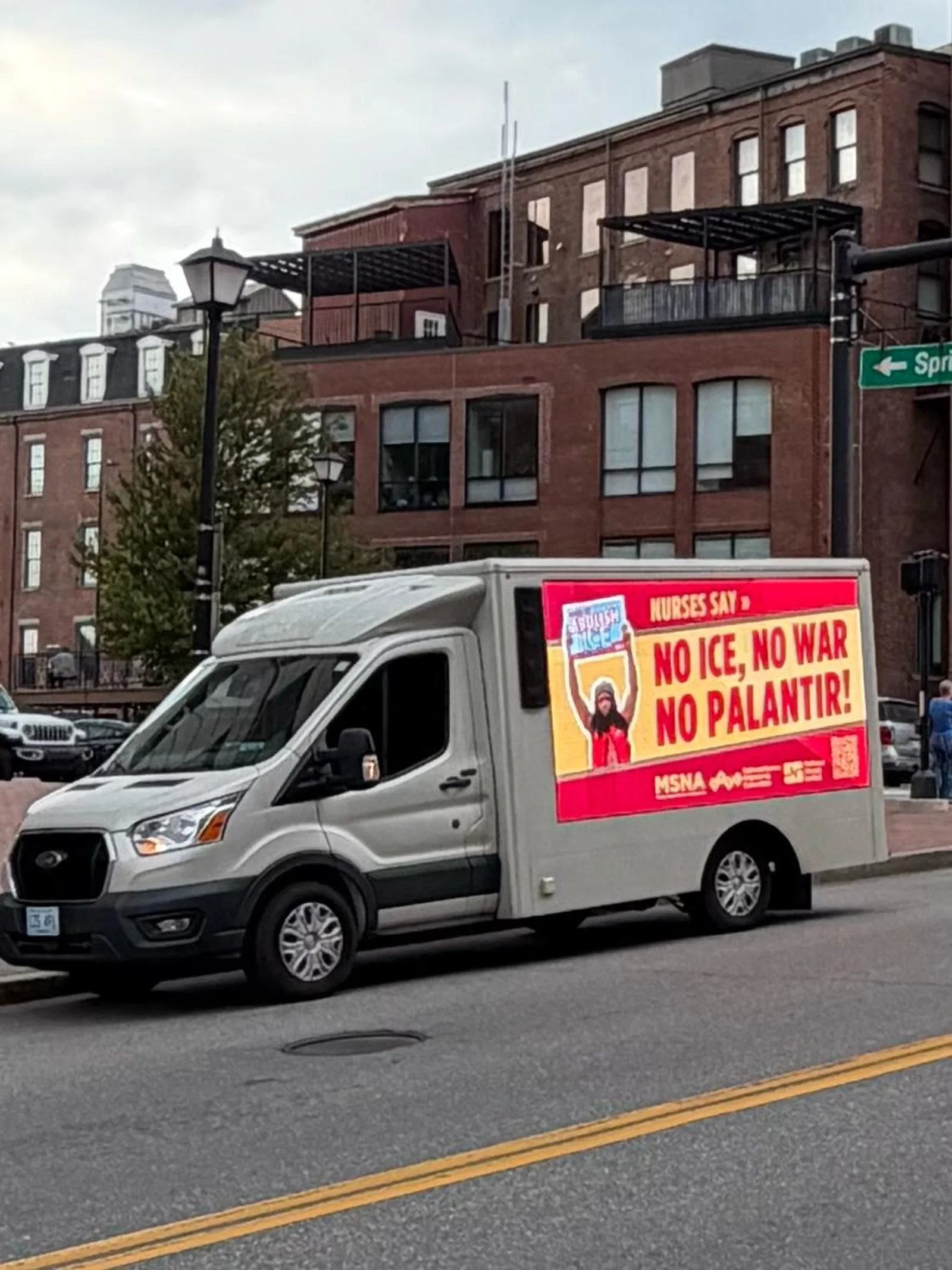 Mobile LED billboard truck advertising in downtown Portland, Maine with a nurses union advocacy message on the side screen