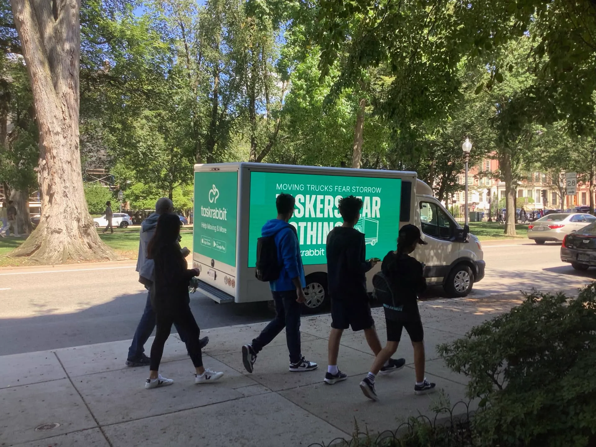 Two LED billboard trucks running a TaskRabbit back-to-school advertising campaign in Boston