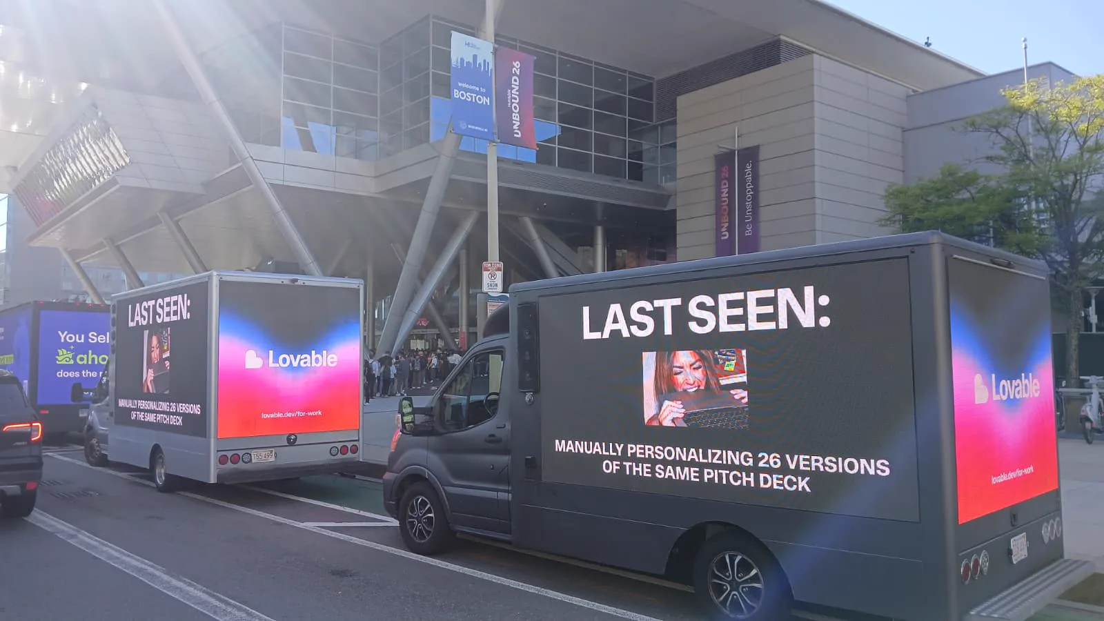 Two Lovable mobile LED billboard trucks advertising beside UNBOUND 2026 conference crowds in Boston
