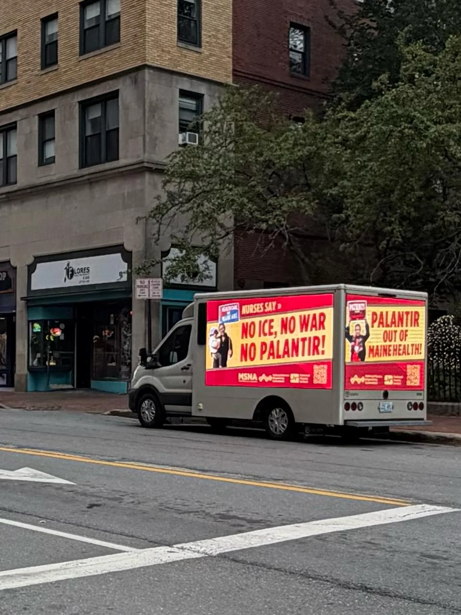 Union advocacy mobile billboard truck on a Portland Maine street corner showing two LED panels