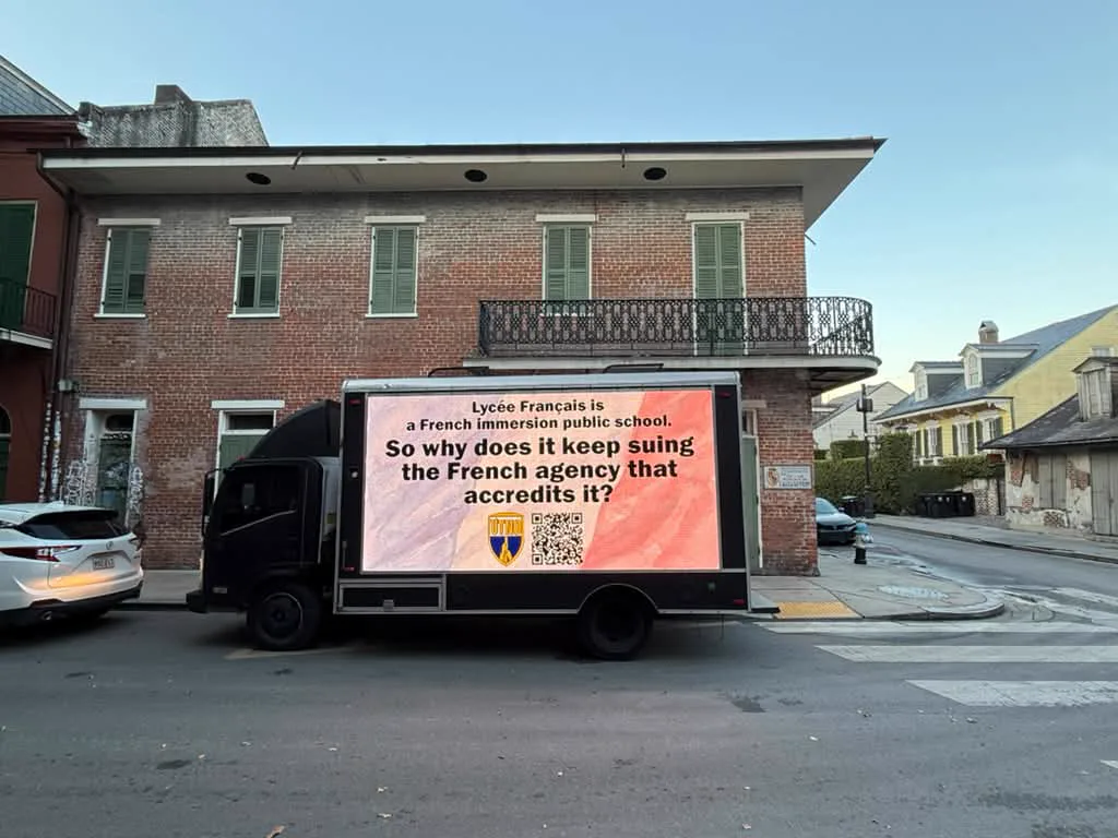 LED billboard truck supporting United Teachers of New Orleans on a historic New Orleans street